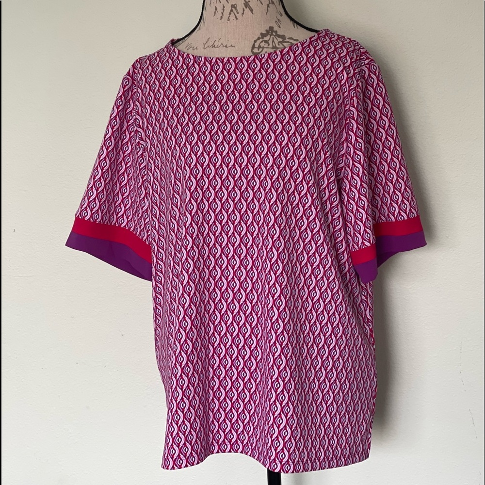 Short sleeve Chico’s top. Never been worn.